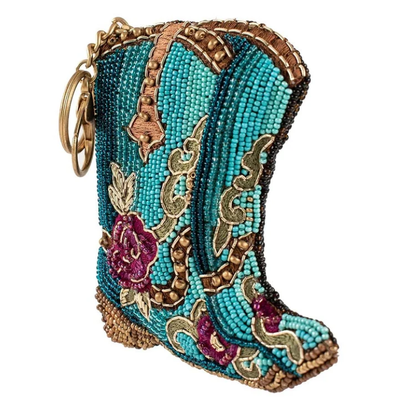 Kickin'Around Coin PurseSoft pink beaded coin bag with glittering gold crown zipper closure easy open trigger hook key ring and credit card fitting compact design. सोने के मुकुट के साथ हल्के गुलाबी मोती बैग को बंद करना आसान है। ट्रिगर हुक कुंजी रिंग और क्रेडिट कार्ड फिट कॉम्पैक्ट डिजाइन